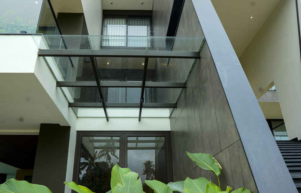 Glass pergola installation works in Kerala with premium weather-resistant glass and modern framing