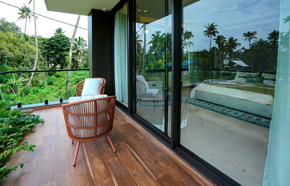 Clear toughened glass railing for a modern home balcony.